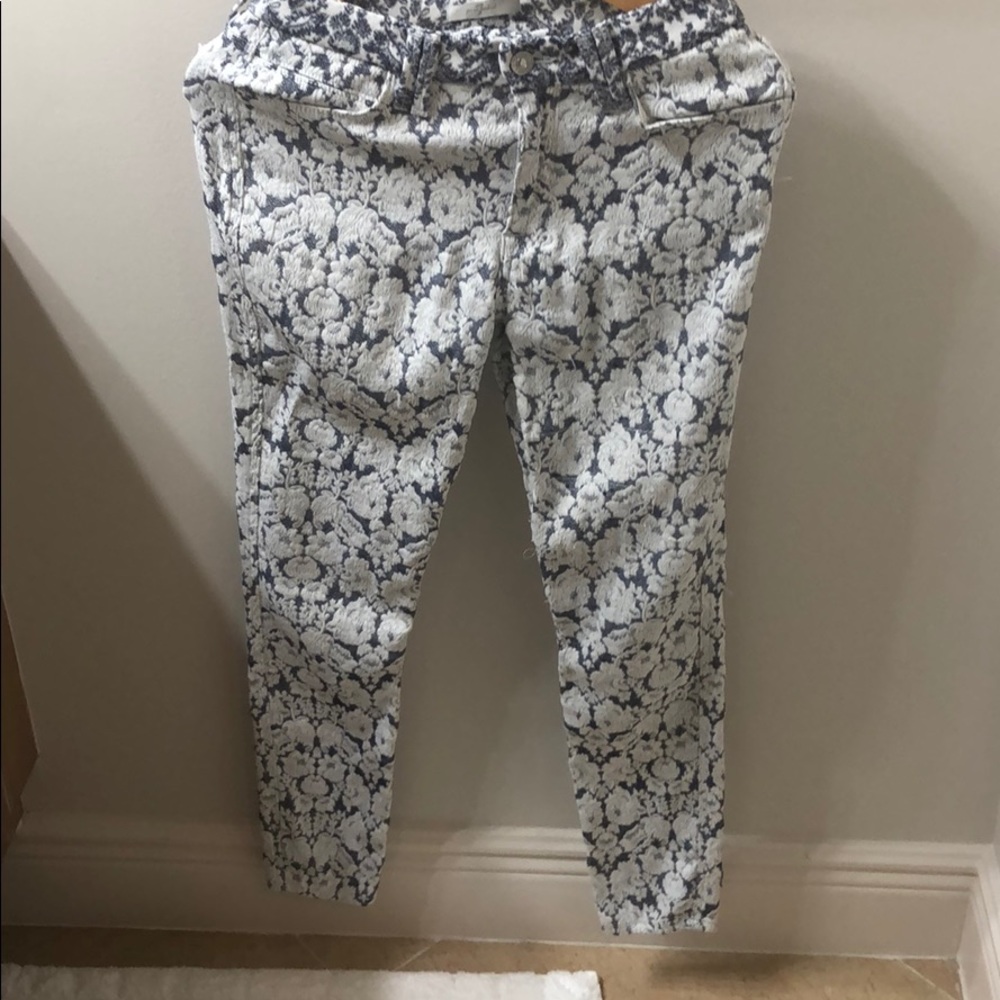 Lace overlay denim skinny jeans.